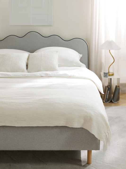 Rombiso Upholstered Bed with Wavy Headboard