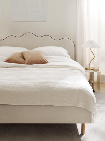 Rombiso Upholstered Bed with Wavy Headboard